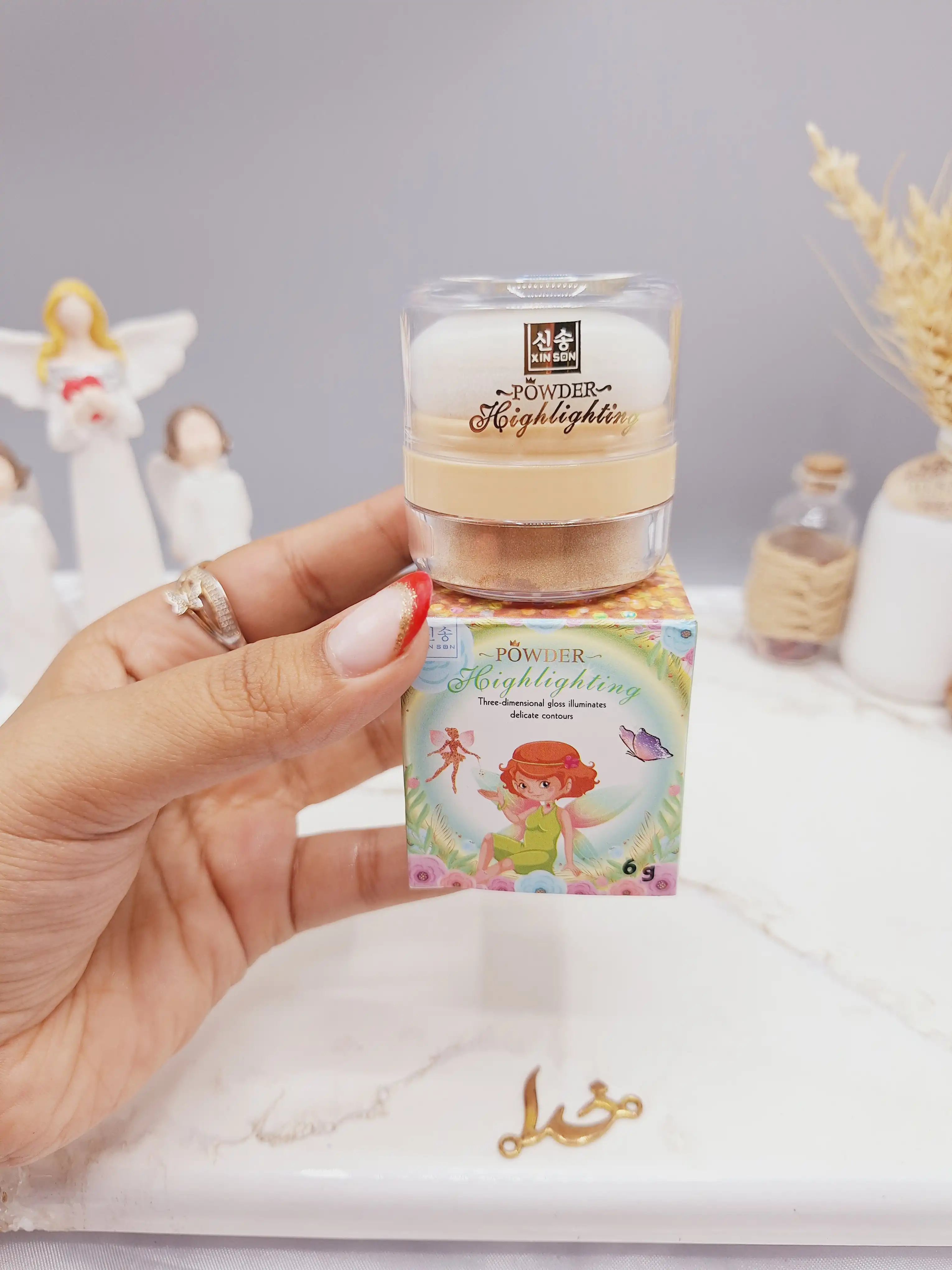 هایلایتر پد دار شاین ریز رنگ طلایی مناسب کل بدن طرح پری برند POWDER کد XS-1096